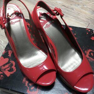 NEW. Fergalicious patent leather orange sandals. Never worn. Sz7M